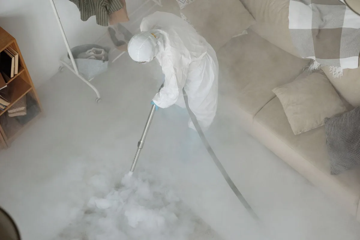 Biohazard cleanup technician in protective equipment, Portage, MI